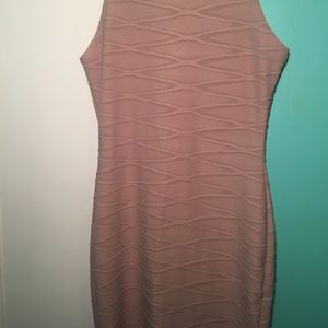 Tight tan dress with unique ribbed details